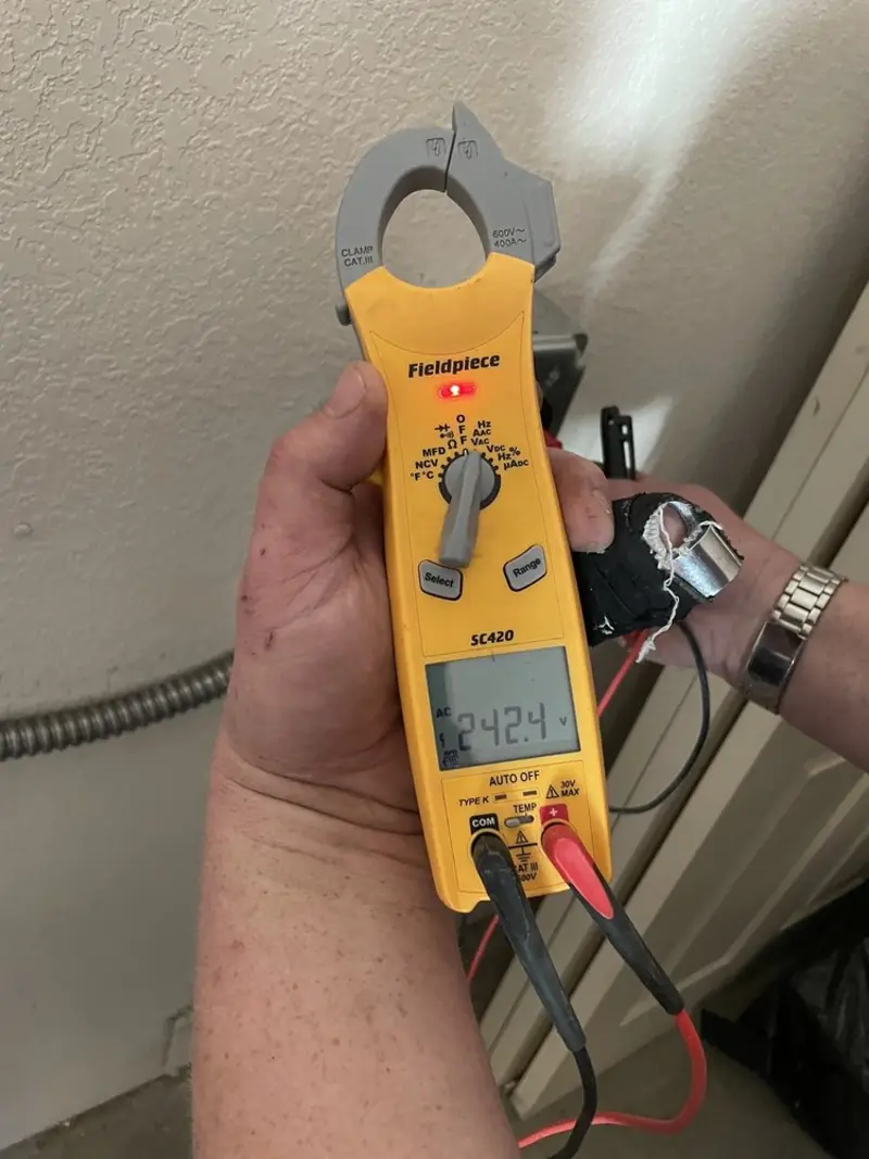 Voltage testing with clamp meter during Aluminum Wiring Replacement in Paulden